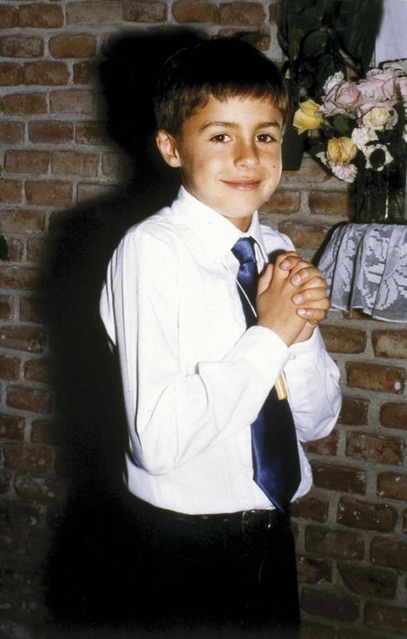 Imagen Cara de niño bueno, con el lunar inconfundible en su mejilla izquierda.